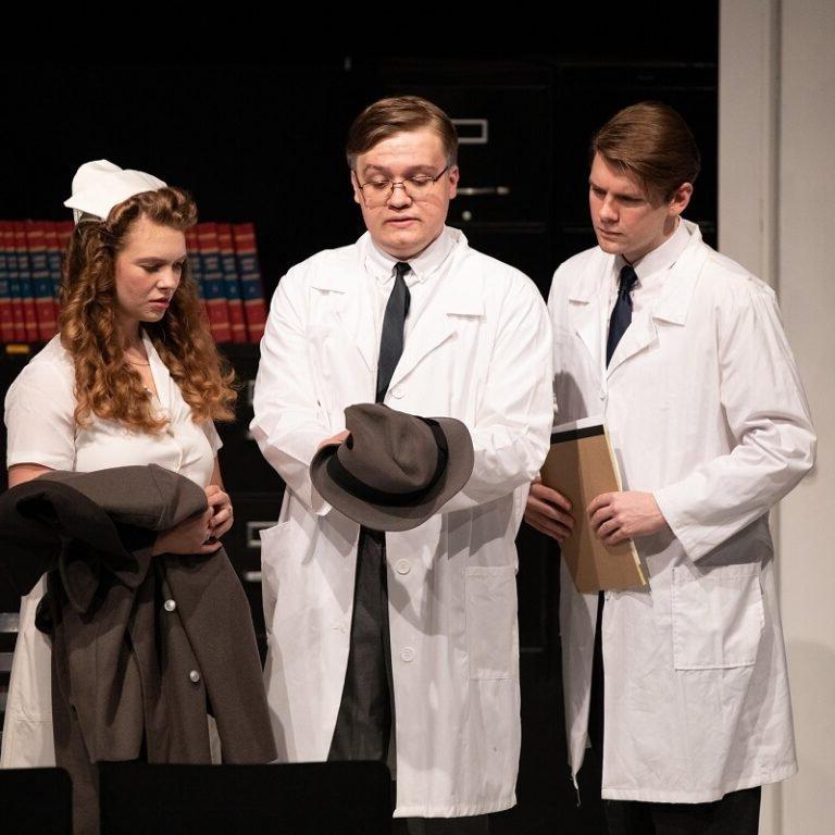 Three students in a play.